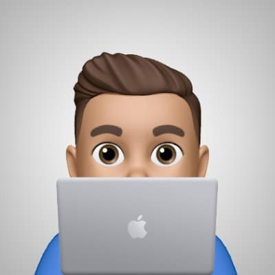 Golden Hand logo, Memoji behind a MacBook